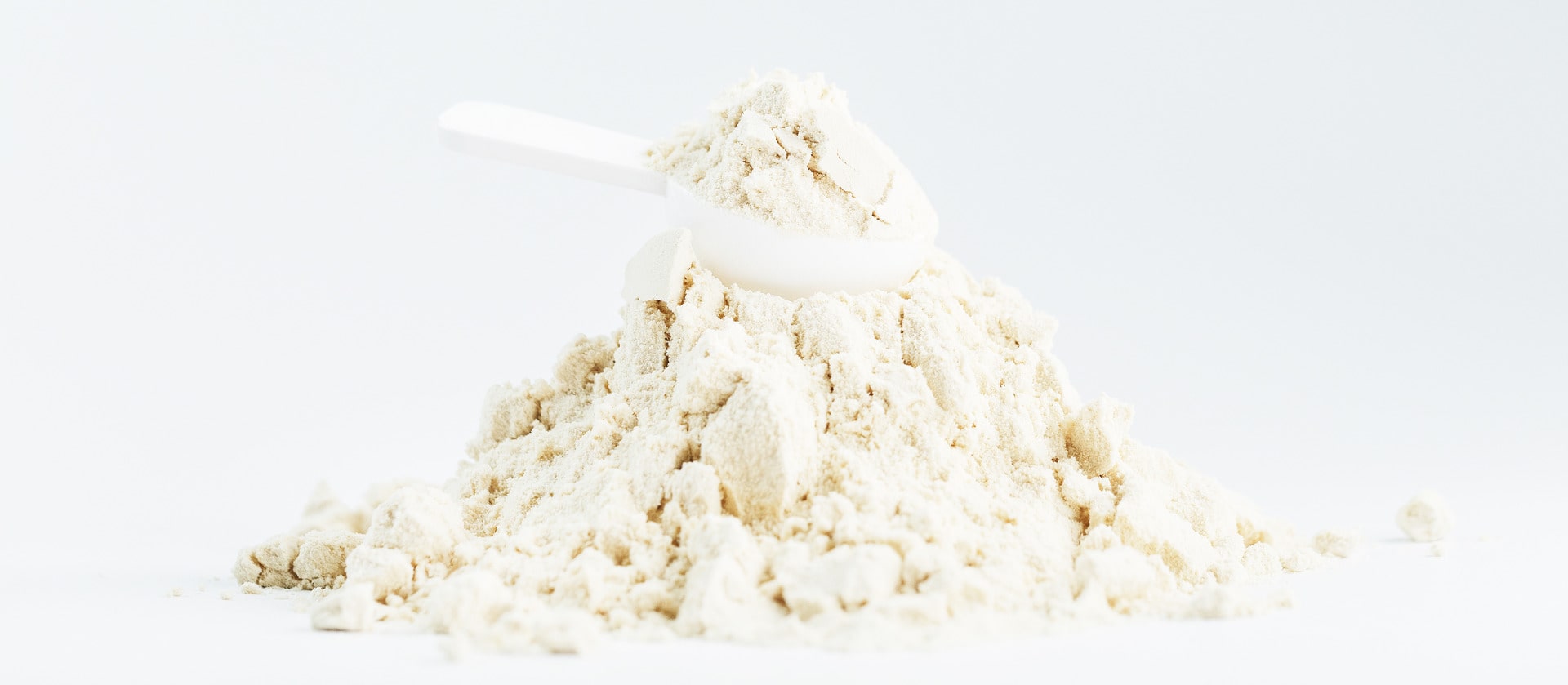 Pile of white powder on a light gray background